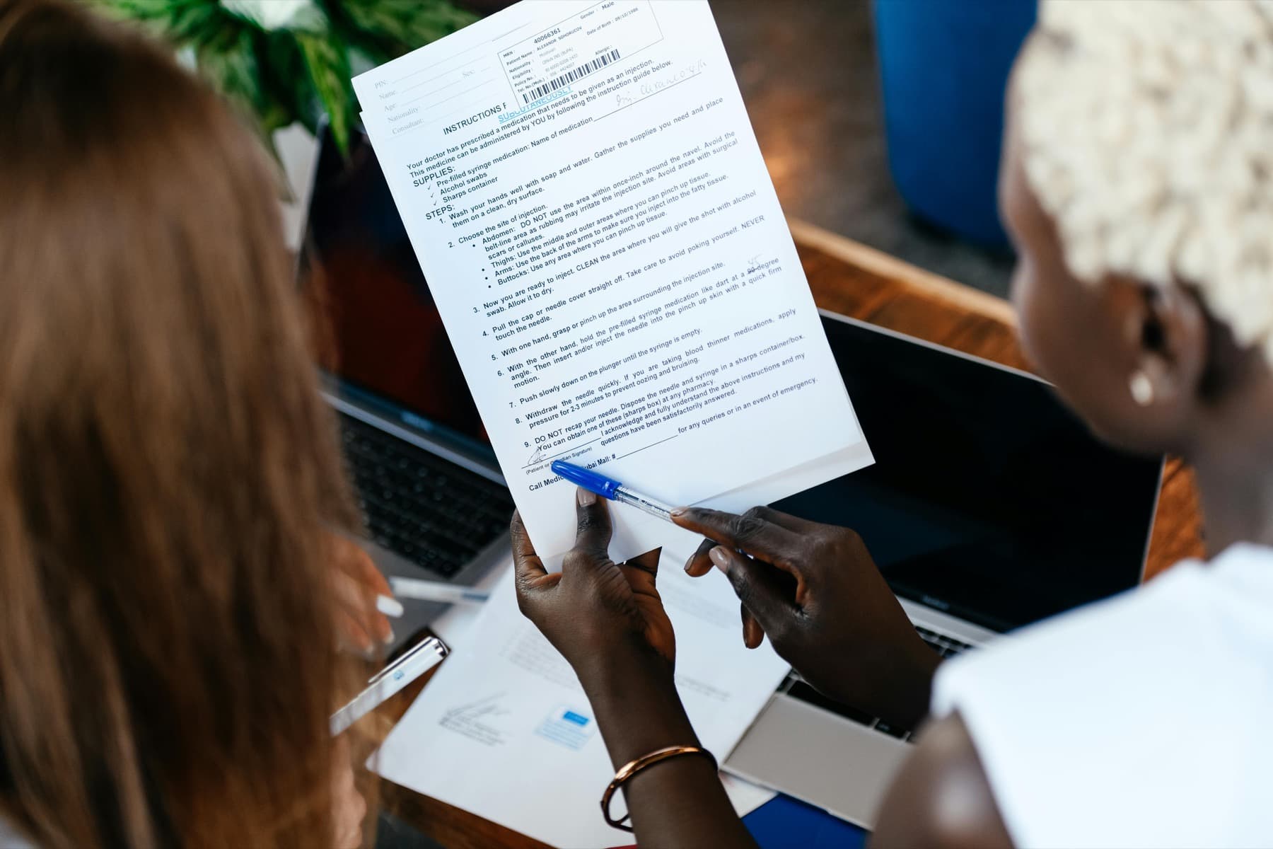 Professionals reviewing bid documents at a table