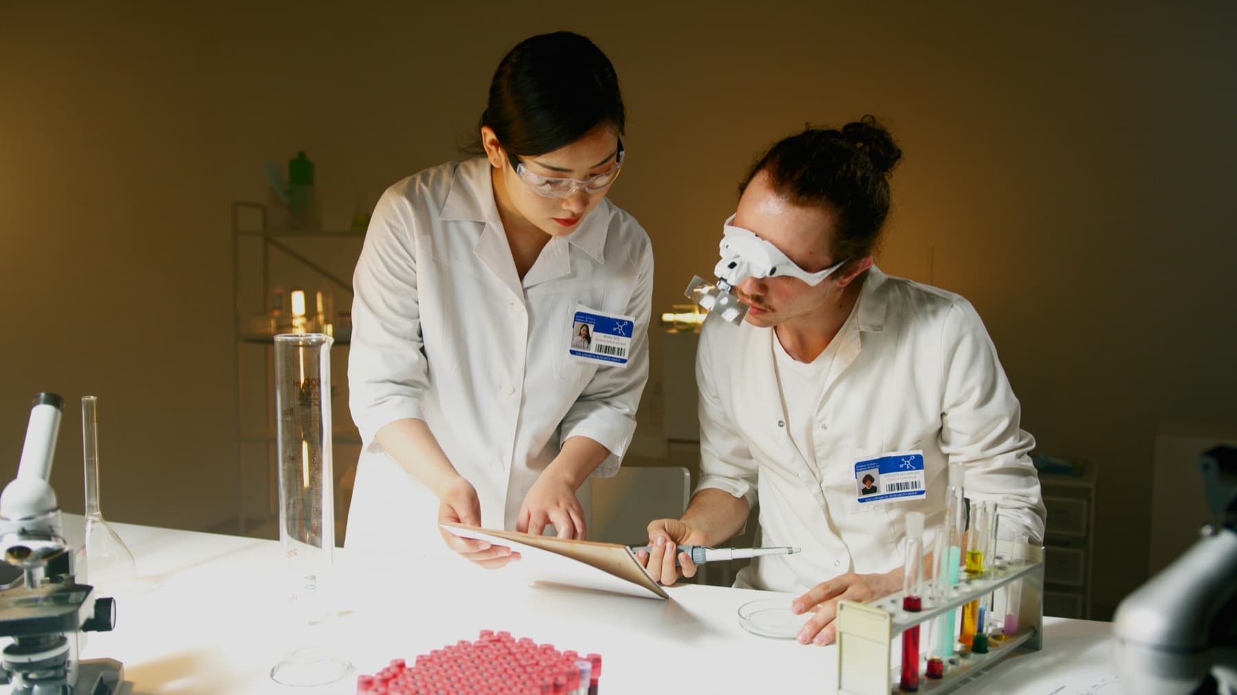 Scientists reviewing notes in a laboratory